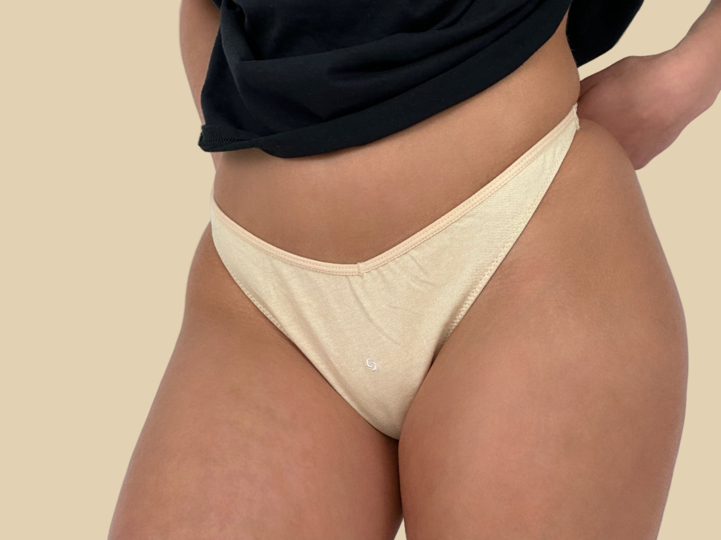 This image features the "Number 3 in Vanilla Bean," a stylish and comfortable thong underwear. The underwear is crafted from 100% cotton, emphasizing breathability and comfort.