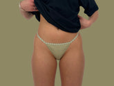 This image features the "Number 2 in Potted Sage," a minimalist-style G-string underwear made from 100% cotton for breathability. The underwear is designed with a barely-there aesthetic, featuring a thin, stretchy embroidered band that enhances its subtle and elegant appearance.